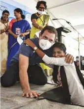  ?? — PTI ?? Congress leader Rahul Gandhi poses for photos with a student during a visit to the Bharathida­san Government College for Women in Puducherry on Wednesday.