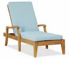  ??  ?? Pottery Barn’s classic teak Hampstead chaise and cushion ($1,211) has scooped arm posts and tapered legs.