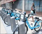  ?? ANTONIO PEREZ/CHICAGO TRIBUNE 2019 ?? The Divvy expansion this year will include 66 new docking stations and 10 miles of new bike lanes.