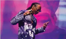  ?? Simone Joyner/Getty Images ?? ‘There aren’t enough hyphens to describe him’: Snoop Dogg at the O2 Arena. Photograph: