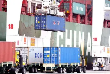  ??  ?? Shipping containers at Pier J at the Port of Long Beach wait for processing in Long Beach, California. Railroad and trucking stocks took a hit starting in late January just like the rest of the market. — Reuters photo