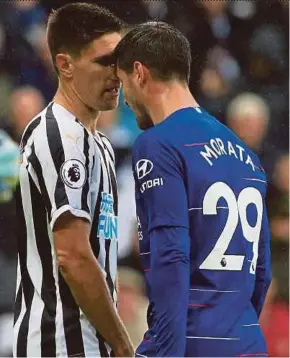  ?? AFP PIC ?? Newcastle United’s Federico Fernandez (left) confronts Chelsea’s Alvaro Morata at St James’ Park on Sunday.