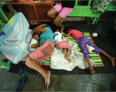  ?? AFP ?? Residents at a shelter after lava from Mount Mayon in Albay province, south of Manila, rushed 500 metres down the mountain