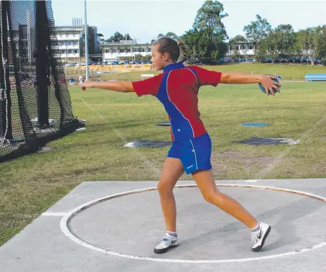  ??  ?? Ebony Gabriel of Year 7 hones her discus skills.