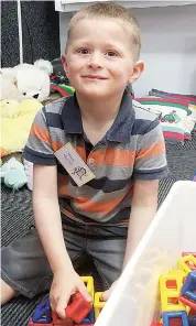  ??  ?? New prep student for 2021, Mack, decided to play with some building toys during his first visit to his new school.