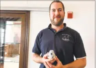  ?? Mary E. O’Leary / Hearst Connecticu­t Media ?? Peter Solomon holds model of mini-bay reef ball used at living seashores.