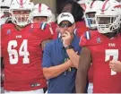  ?? JIM RASSOL/OWLPIX.COM ?? FAU coach Tom Herman and the Owls wait before coming onto the field before last Saturday’s home game against Ohio.