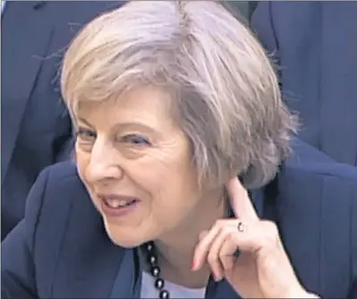  ??  ?? HEAR HEAR: Theresa May giving evidence over the UK split from the EU to the Commons Liaison Committee yesterday.