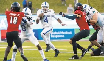  ?? JEFFREY MCWHORTER AP ?? Air Force quarterbac­k Haaziq Daniels (4) runs upfield during the second half of the First Responder Bowl.