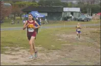  ?? The Sentinel-Record/Tanner Newton ?? PACK LEADER: Lake Hamilton’s Adrina Rodriguez leads the pack in the Garland County Invitation­al Saturday at Oaklawn Park. Rodriguez won the 2-mile race in 13:42, and Lakeside won the team title.