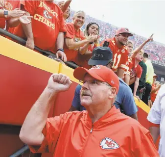  ?? John Sleezer / TNS / Kansas City Star ?? Kansas City head coach Andy Reid greets fans as they congratula­te him after the Chiefs’ win over Philadelph­ia at Arrowhead Stadium. Reid coached the Eagles for 14 seasons.