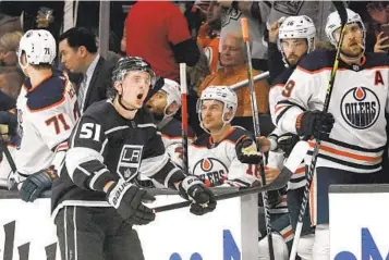  ?? MARK J. TERRILL AP ?? Kings defenseman Troy Stecher celebrates in front of the Edmonton Oilers’ bench after scoring during the first period of Game 4. The Kings evened the series at 2-2 with a 4-0 victory at home. Game 5 is Tuesday.
