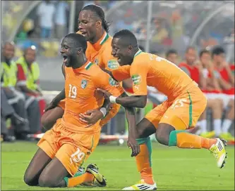  ?? Picture by Veli Nhlapo ?? IT’S IN! Scorer Yaya Toure, Didier Drogba and Max Gradel of Ivory Coast celebrate their second goal during their Afcon match against Tunisia.MARKSMAN: Yao Gervinho of Ivory Coast netted first