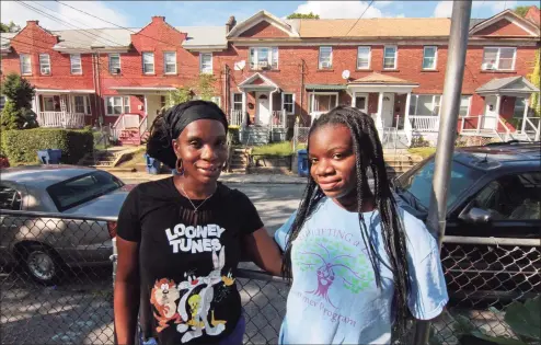  ?? Christian Abraham / Hearst Connecticu­t Media ?? Sha'Nia Cooper, 15, right, poses with her mom Erika Cooper at their home in Waterbury on Sept. 1. Sha'Nia was arrested at school after getting into a fight in 2019. Waterbury consistent­ly has the highest school-based arrest rate, at three times the state average.
