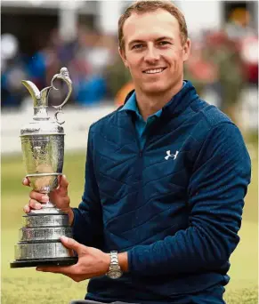  ??  ?? Just too good: American golfer Jordan Spieth posing with the Claret Jug after winning the 2017 British Open on Sunday. – AFP