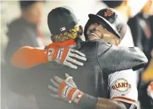  ?? Jeff Haynes / Associated Press ?? Pablo Sandoval celebrates after hitting a three-run home run to end an 0-for-39 skid and get the Giants on the board.