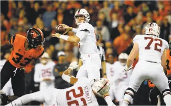  ?? Jonathan Ferrey / Getty Images ?? Keller Chryst struggled against Oregon State on Thursday night, going 16-for-33 for 141 yards.