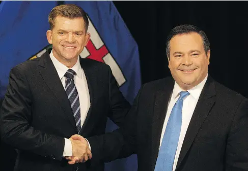  ?? DAVID BLOOM ?? Wildrose Party leader Brian Jean, left, and Alberta PC leader Jason Kenney meet the press in Edmonton Thursday to announce they reached a deal to merge the right-wing parties, creating the United Conservati­ve Party. Both men say they will vie for the...