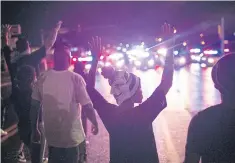  ??  ?? ANGER REMAINS: Demonstrat­ors marking the one-year anniversar­y of the shooting of Michael Brown face off with police during a protest in Ferguson, Missouri.