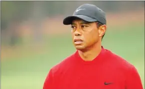  ?? AFP ?? Tiger Woods, recovering from his serious car accident, will not be at the Augusta Masters on Thursday, where it all began for his prodigious career now on hold.