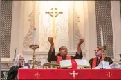  ?? JENNI GIRTMAN FOR THE AJC 2023 ?? Bishop Robin Dease breaks bread for Communion during her installati­on as leader of the North Georgia Conference of the United Methodist Church in January 2023. She was the first Black woman appointed to the position.