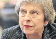  ?? AFP ?? Britain’s Prime Minister Theresa May reacts during her visit to Queen’s University in Belfast, Northern Ireland on Tuesday.