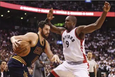  ?? FRANK GUNN — THE CANADIAN PRESS VIA AP ?? Cavaliers forward Kevin Love protects the ball from Raptors forward Serge Ibaka during the second half of Game 3 of the Eastern Conference semifinals in Toronto on May 5.