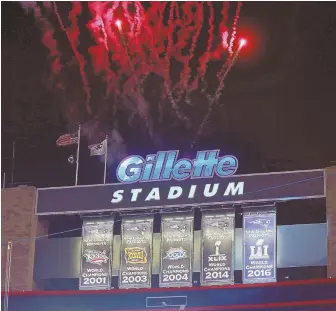  ?? STAFF PHOTO BY MATT STONE ?? EARLY BRIGHT SPOT: With fireworks in the background, the Patriots unveiled their Super Bowl LI championsh­ip banner before last night’s game at Gillette Stadium.