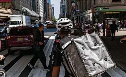  ?? Mark Abramson / New York Times ?? A food delivery workers bikes in Manhattan. The worst part about DoorDash’s pay scandal is that the company stuck with it for so long despite its clear unfairness.