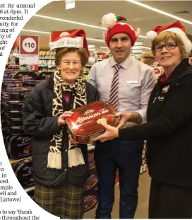  ??  ?? Paul O’Connor (Manager Garvey’s Listowel) and Bridget Collins (Garvey’s) giving Bridie Leahy a helping hand in doing her Christmas shopping in Garvey’s Listowel.