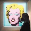  ?? Reuters-Yonhap ?? Andy Warhol’s “Shot Sage Blue Marilyn,” a painting of Marilyn Monroe, is pictured on display at Christie’s Auction House in advance of the piece going up for auction in the Manhattan borough of New York City, N.Y., March 21.