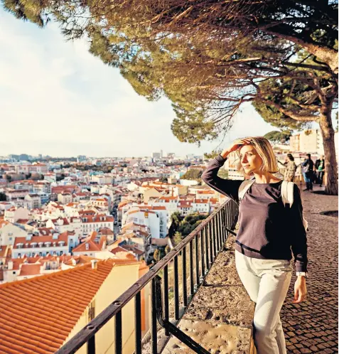  ??  ?? i Panorama: take in the ‘sweeping views across the city’s red-tiled roofs’ in peace g Have your pick of the tables at Café A Brasileira