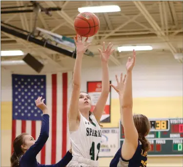  ?? SENTINEL & > ENTERPRISE / GARY FOURNIER ?? Oakmont’s Victoria Mays fires a shot over Quabbin Regional’s Riley Bassett during Wednesday’s game.