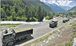  ?? WASEEM ANDRABI/HT ?? An Indian Army convoy moves along a highway leading to Ladakh, at Gagangeer in Ganderbal district of ■
Jammu and Kashmir on Wednesday.