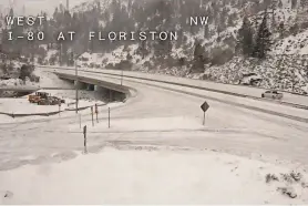  ?? PROVIDED BY CALTRANS VIA AP ?? A snow-covered Interstate 80 is seen in Floriston, Calif., on Friday as the National Weather Service warned of a “cold and dangerous winter storm” that would last through Saturday across the state.