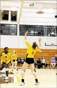  ?? ?? Starkville High School senior Abbigail Upchurch (7) goes up to strike the volleyball, while Zariyah Edwards (25) and Sarah Skelton (2) move in to assist on Tuesday night. (Photo by Olivia More, for Starkville Daily News)