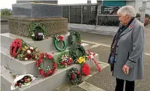  ?? JAMIE SEARLE/STUFF ?? Dorothy Fraser admires wreaths at the Wallace Troopers Memorial at Riverton. Her late husband, Lyall Fraser, served in World War II.