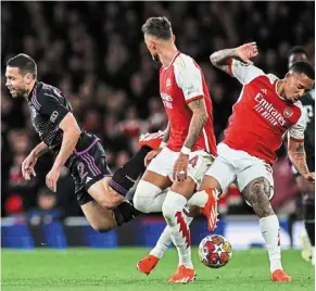  ?? ?? getting rough: arsenal’s gabriel Jesus (right) fouls Bayern’s raphael guerreiro (left). — afp