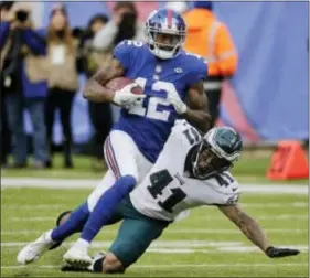  ?? SETH WENIG — THE ASSOCIATED PRESS ?? Eagles cornerback Ronald Darby, here watching Giants receiver Tavarres King run past him for a touchdown last Sunday, owned up to both a rough outing at MetLife Stadium and to the social-media saltiness that followed.