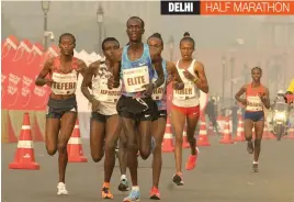  ?? — PRITAM BANDYOPADH­YAY ?? The elite women’s athlete in action during the Airtel Delhi Half Marathon on Sunday.