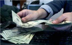  ?? AFP ?? The dollar edged up 0.2 per cent against a basket of currencies on Friday, after having shed 1.3 per cent in the past two weeks. —