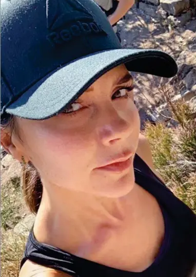  ??  ?? Out hiking: Victoria Beckham poses for a selfie during her break at the exclusive spa