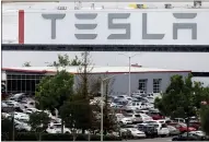  ?? ANDA CHU — STAFF PHOTOGRAPH­ER ?? The Tesla electric-vehicle factory in Fremont, here in 2020, is expected to conduct an estimated 1,452layoffs in June.