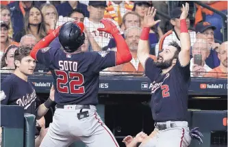  ?? DAVID J. PHILLIP/ASSOCIATED PRESS ?? Washington’s Juan Soto (22) celebrates his home run with Adam Eaton during the fifth inning of Game 6 of the World Series Tuesday.