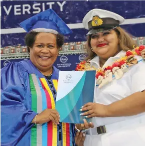  ?? ?? Fiji National University graduate Monisha Shivani Prasad receives her certificat­e from Professor Unaisi Nabobo Baba during the graduation ceremony.