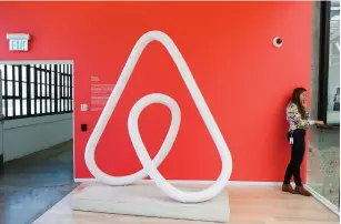  ?? (Reuters) ?? A WOMAN talks on the phone at the Airbnb office headquarte­rs in the SOMA district of San Francisco, California.