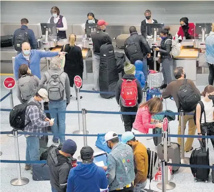  ?? Photo / AP ?? Airports were busy as Americans hurried to see family for Thanksgivi­ng.