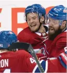  ??  ?? Canadiens winger Artturi Lehkonen (center) rejoices in his game-winning goal.