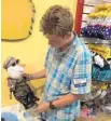  ?? PHOTO BY FALLAN PATTERSON ?? Daniel Peters, 16, dresses his stuffed Olaf during the Kids Needing Kidneys event at Build-ABear in Pembroke Pines.