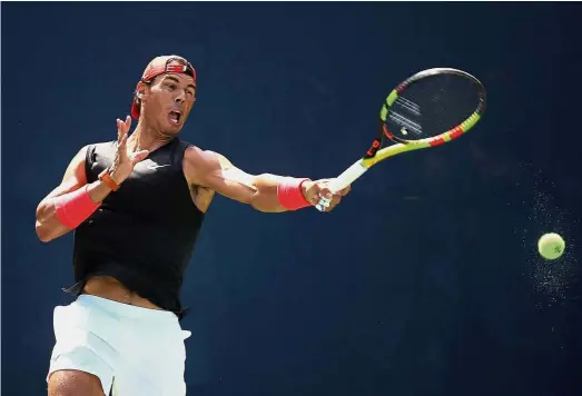  ?? — AFP ?? Hard at work: Rafael Nadal returning a shot during a training session at the USTA Billie Jean King National Tennis Centre on Sunday.